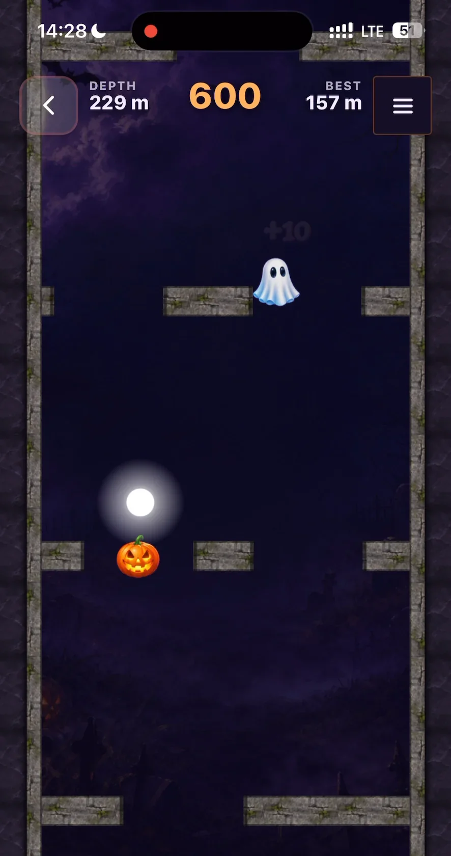 Spooky Tower Drop: the glowing player dot reaches a pumpkin